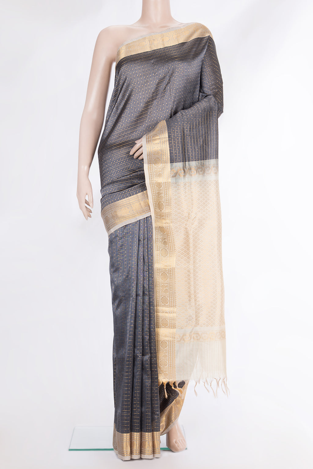 Grey Silk Cotton Saree with Checked design on the body and Zari Border.  displayed on a mannequin