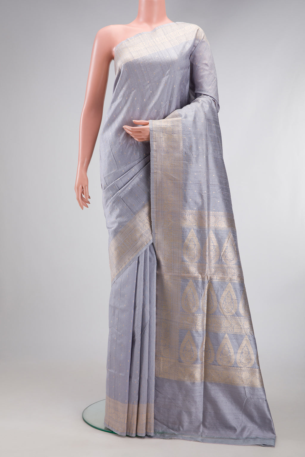 Grey Dual Tone Banarasi Silk Saree with Zari Butta on the body and Zari Border.  displayed on a mannequin
