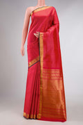 Pink Kanchipuram Silk Saree with Zari Butta on the body and Zari Border displayed on a mannequin