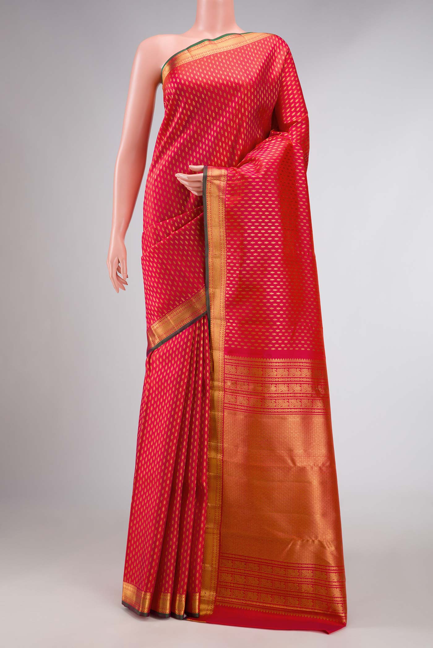 Pink Kanchipuram Silk Saree with Zari Butta on the body and Zari Border displayed on a mannequin