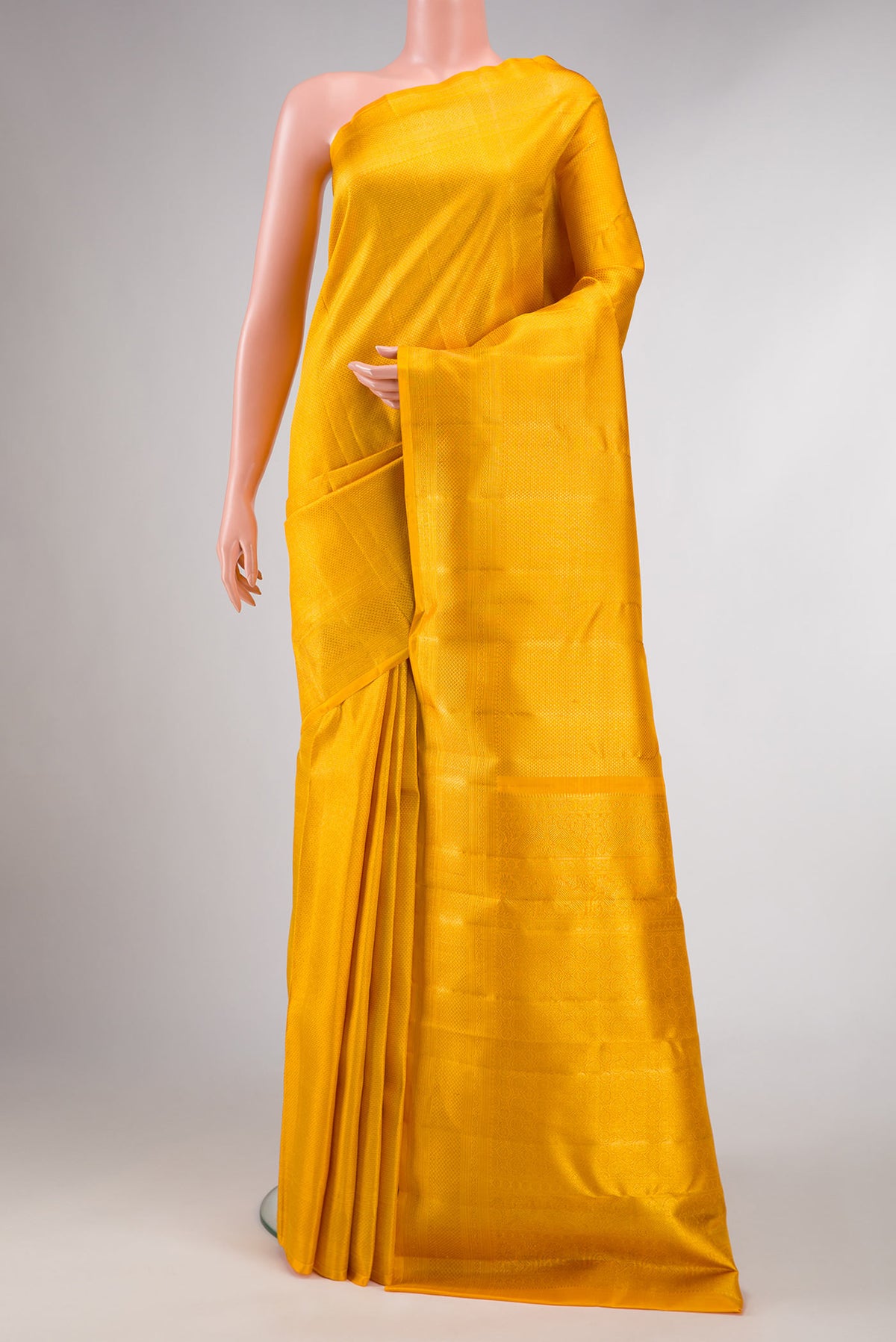 Yellow Dual Tone Kanchipuram Silk Saree with Zari Brocade on the body and Zari Border displayed on a mannequin