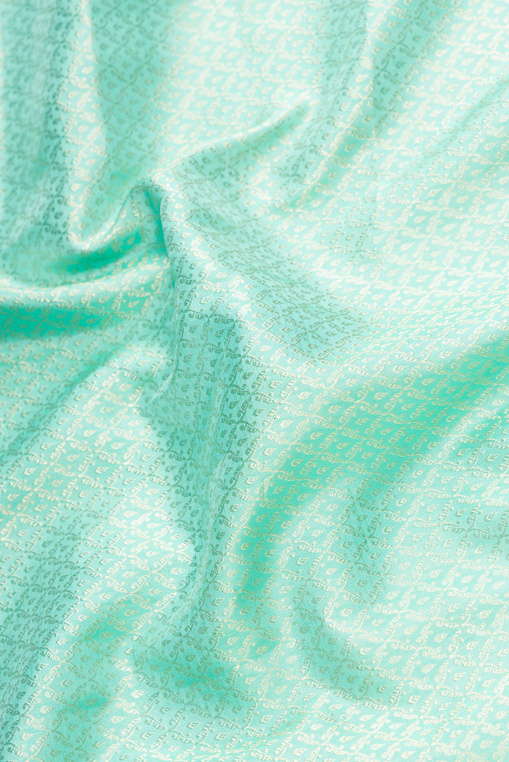 Close up of Light Blue Dual Tone Kanchipuram Silk Saree with Zari Brocade on the body and Zari Border.  displaying folds