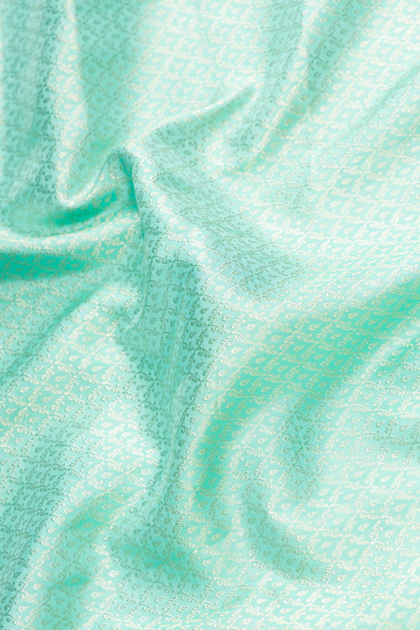 Close up of Light Blue Dual Tone Kanchipuram Silk Saree with Zari Brocade on the body and Zari Border.  displaying folds