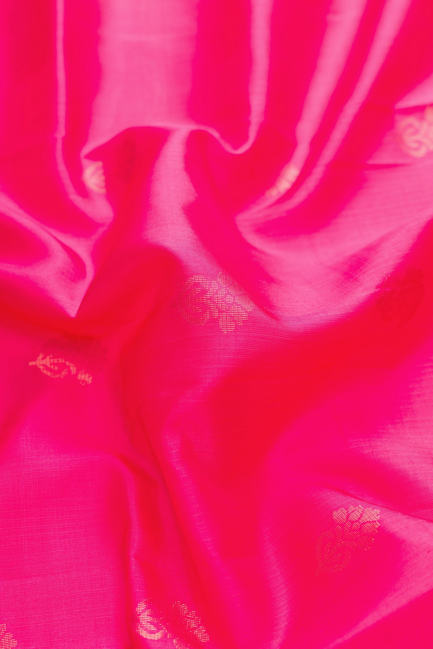 Close up of Pink Dual Tone Soft Silk Saree with Zari Butta on the body and Zari Border displaying folds
