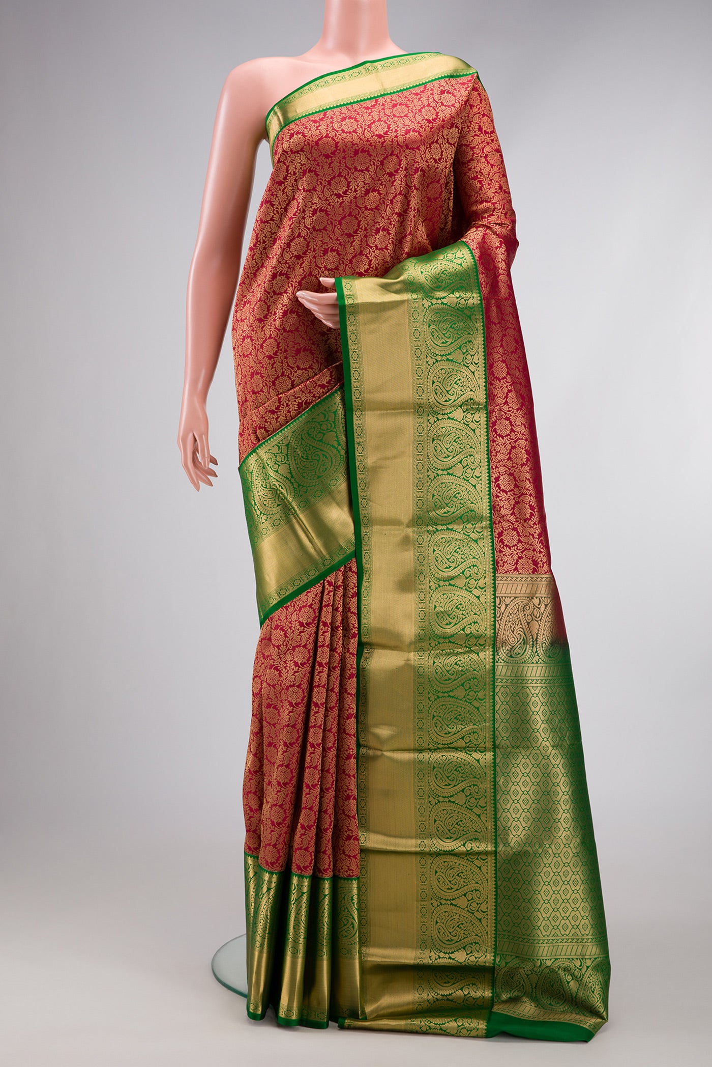Maroon Kanchipuram Silk Saree with Zari Brocade on the body and Zari Border.  displayed on a mannequin