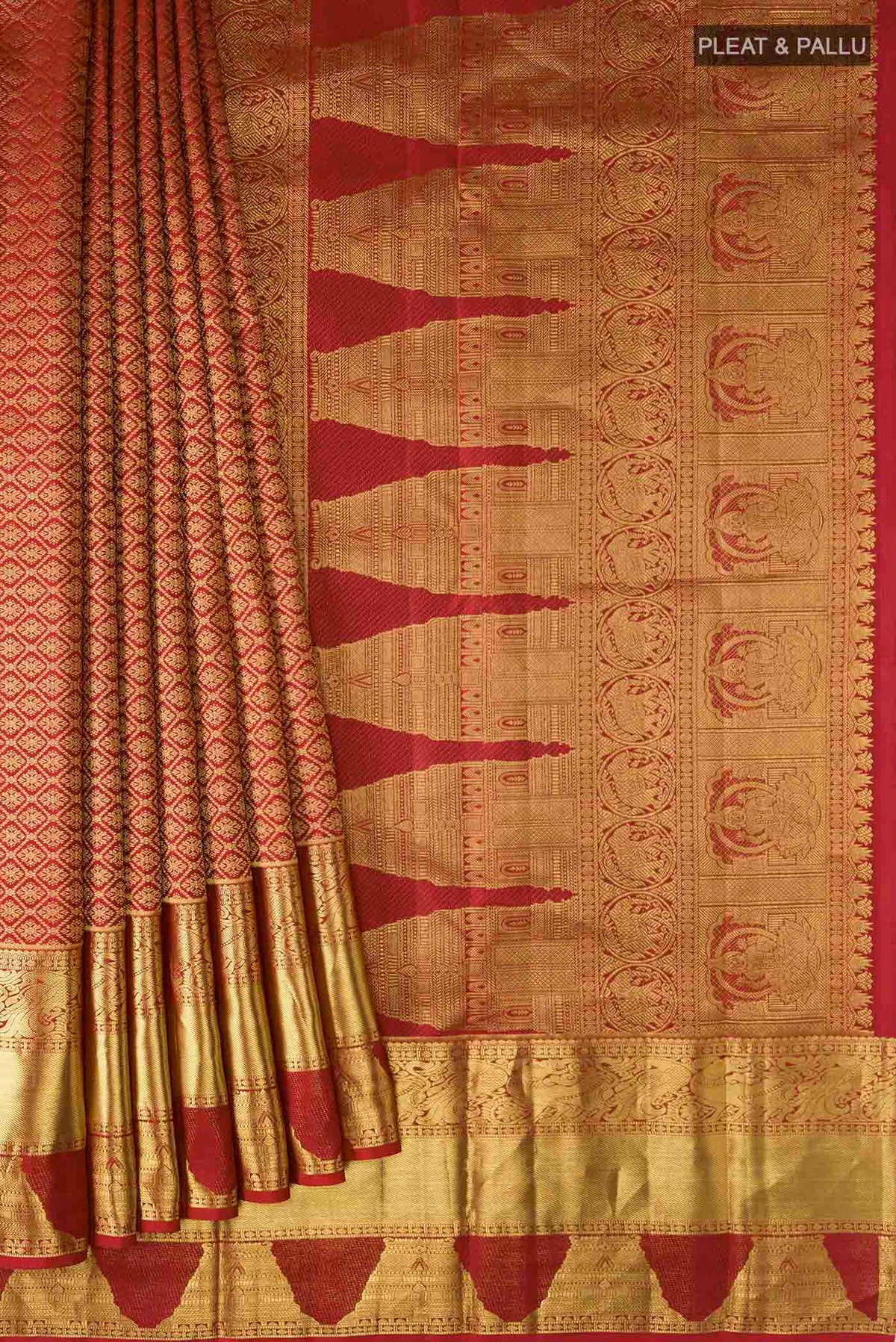 Pleats and pallu of Maroon Kanchipuram Silk Saree with Zari Butta on the body and Zari Border