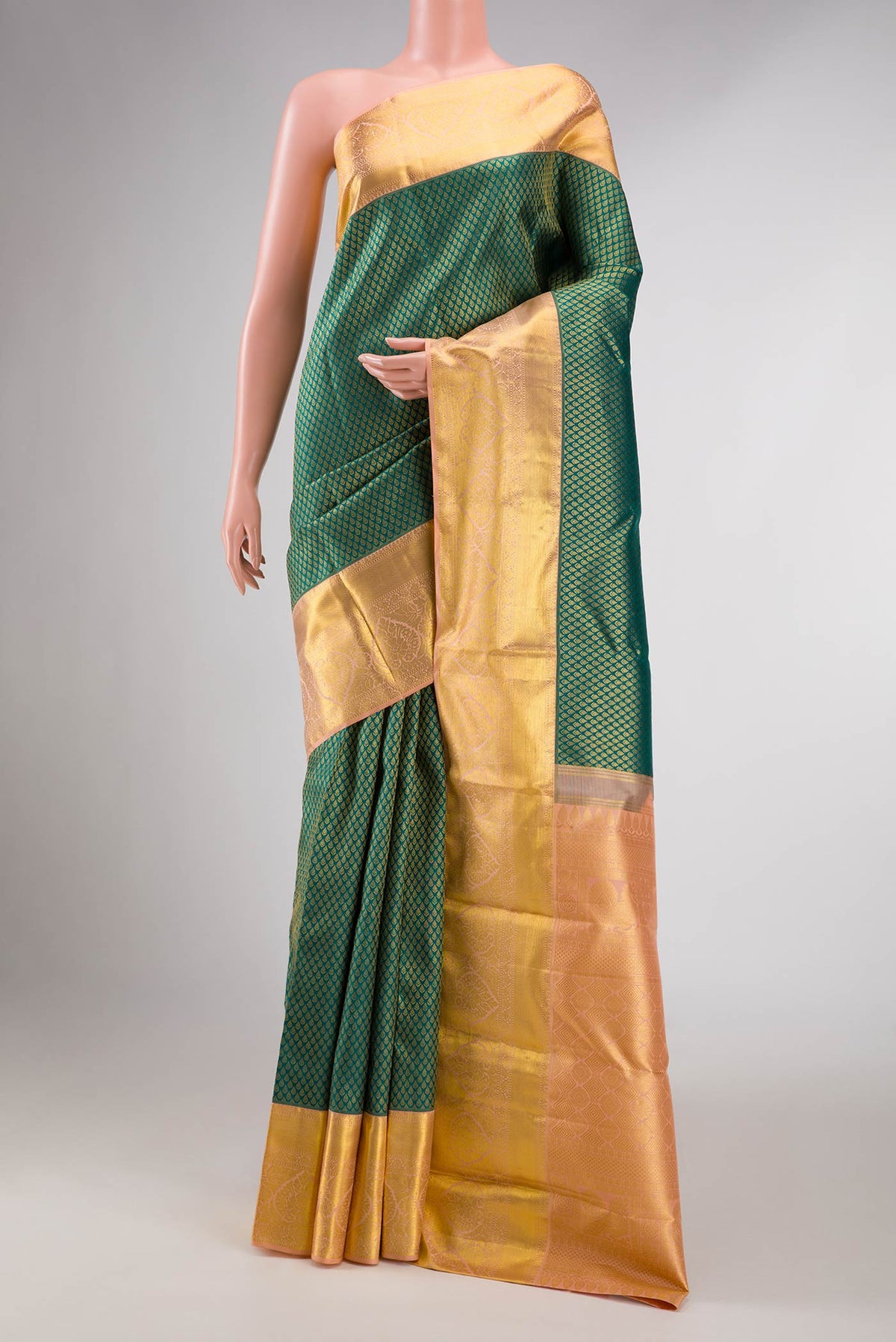 Green Dual Tone Kanchipuram Silk Saree with Zari Brocade on the body and Zari Border displayed on a mannequin