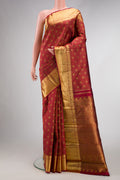 Maroon Dual Tone Kanchipuram Silk Saree with Zari Brocade on the body and Zari Border.  displayed on a mannequin