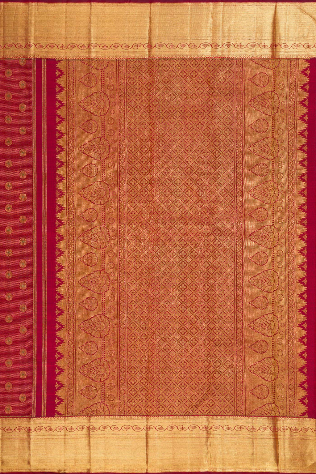 Close up image of the pallu of Maroon Dual Tone Kanchipuram Silk Saree with Zari Brocade on the body and Zari Border. 