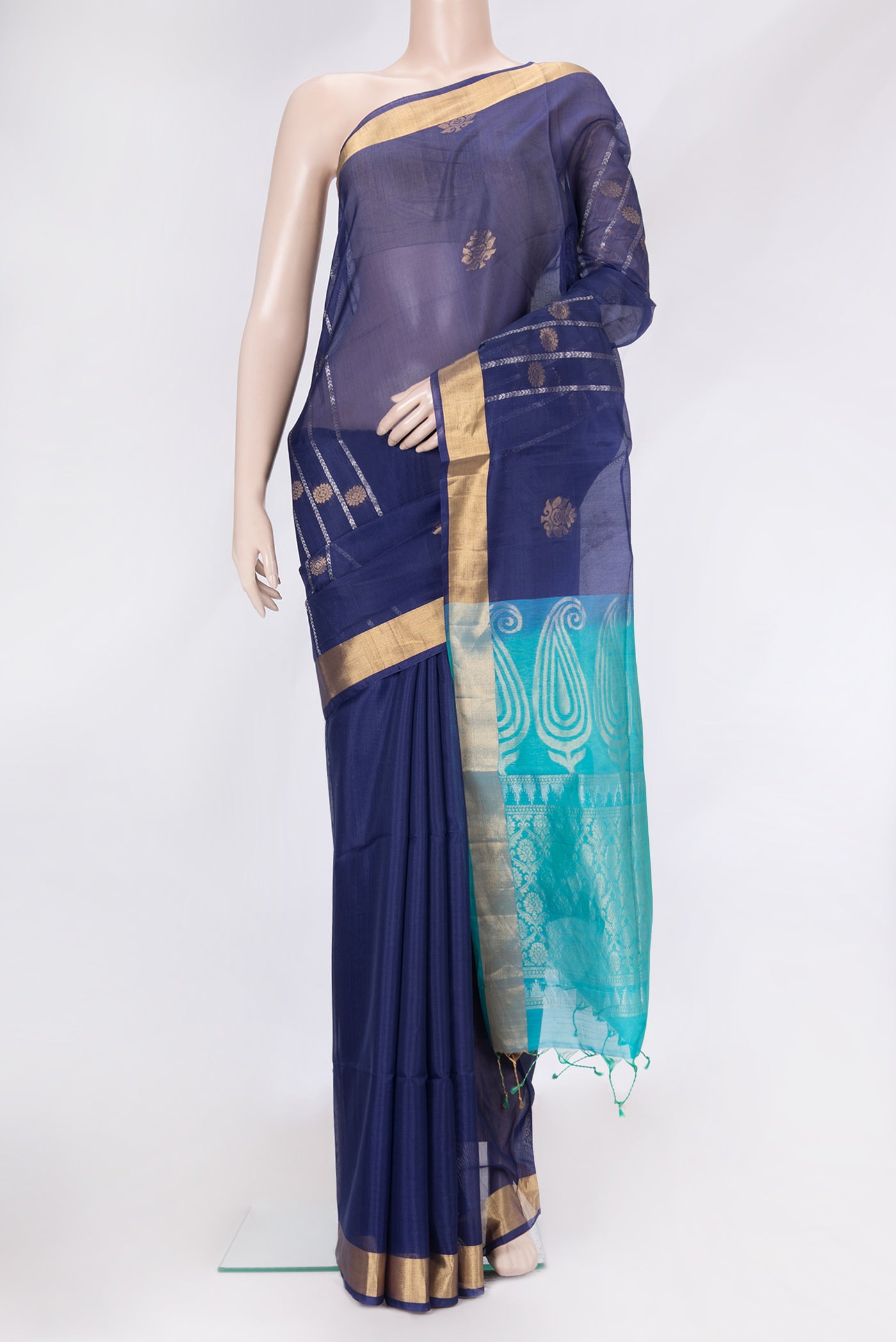 Navy Blue Dual Tone Silk Cotton Saree with Zari Butta on the body and Zari Border.  displayed on a mannequin