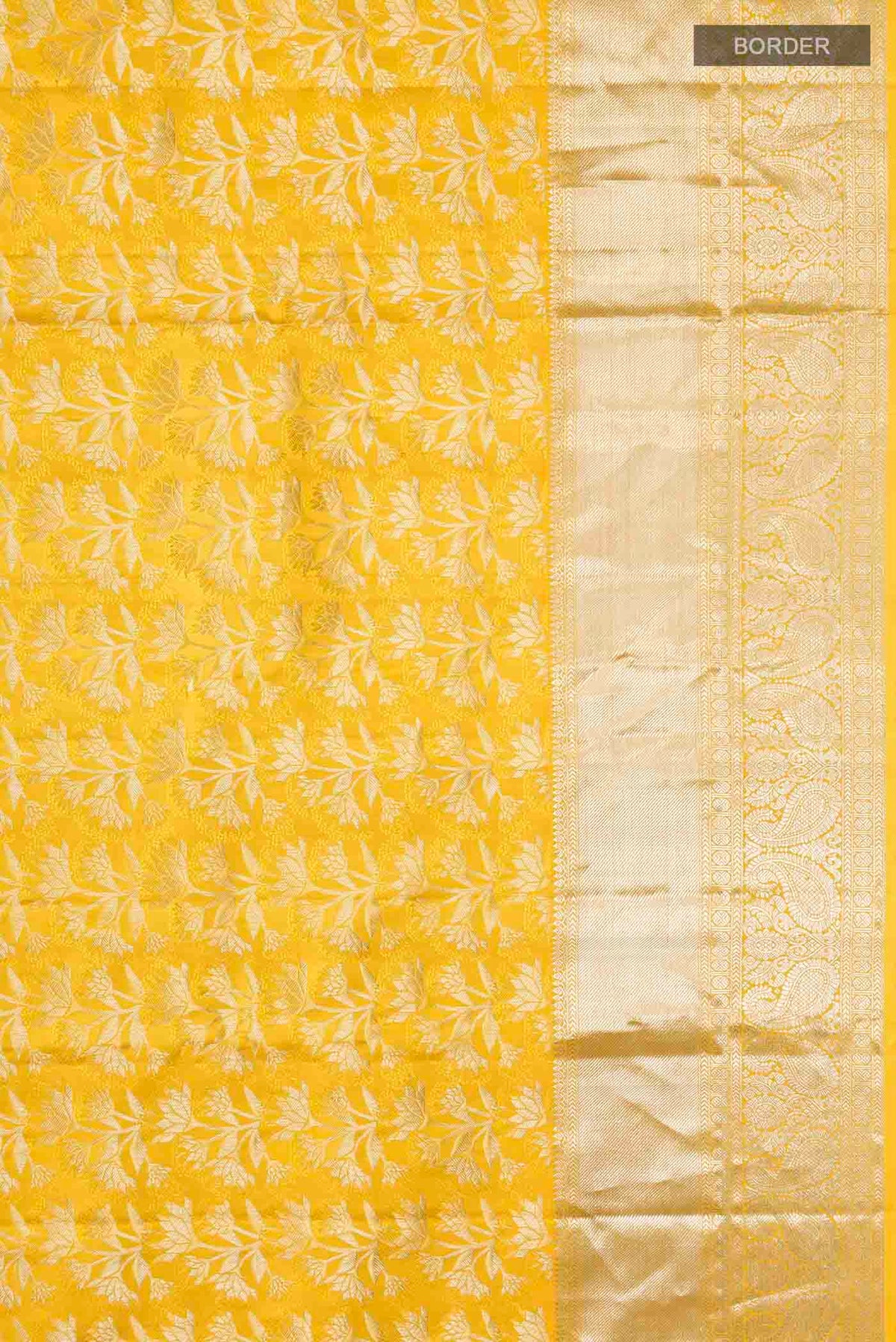 Border image of Yellow Kanchipuram Silk Saree with Zari Brocade on the body and Zari Border