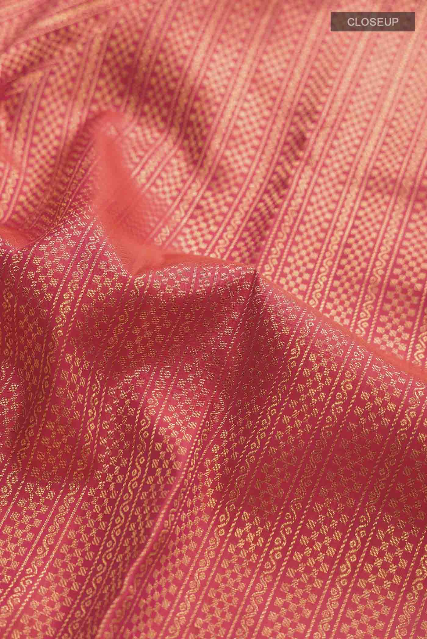 Close up of Multi Color Kanchipuram Silk Saree with Stripes on the body and Zari Border displaying folds