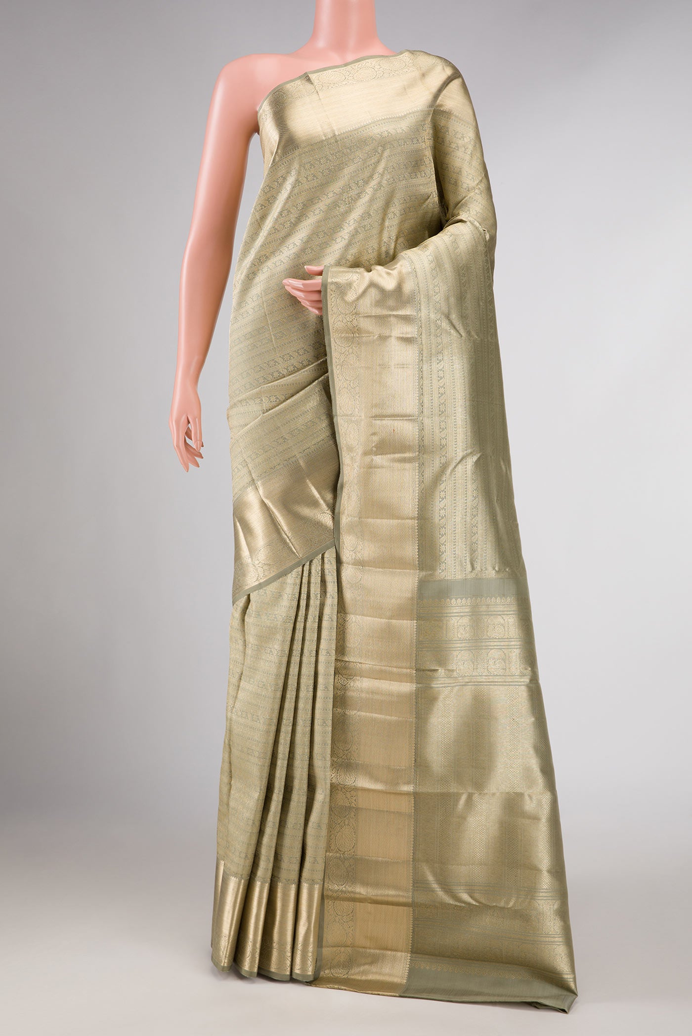Light Green Dual Tone Kanchipuram Silk Saree with Zari Brocade on the body and Zari Border displayed on a mannequin