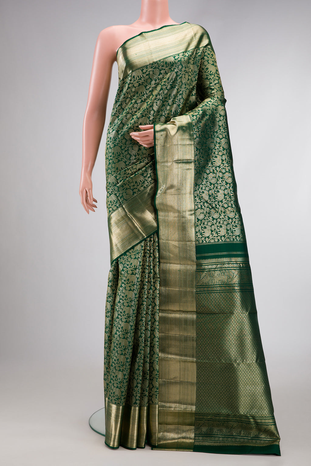Green Dual Tone Kanchipuram Silk Saree with Zari Brocade on the body and Zari Border.  displayed on a mannequin