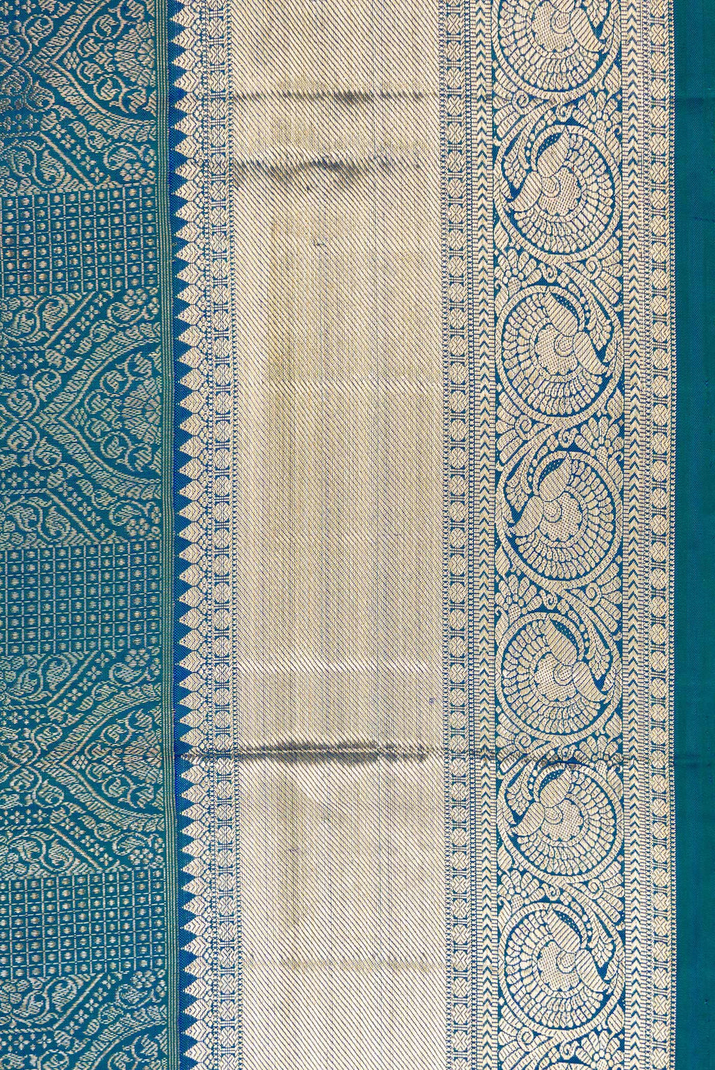 Border image of Peacock Blue Dual Tone Kanchipuram Silk Saree with Zari Brocade on the body and Zari Border. 