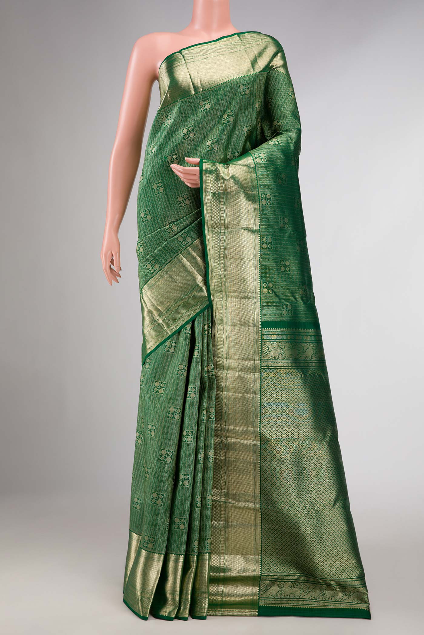 Green Dual Tone Kanchipuram Silk Saree with Zari Brocade on the body and Zari Border displayed on a mannequin