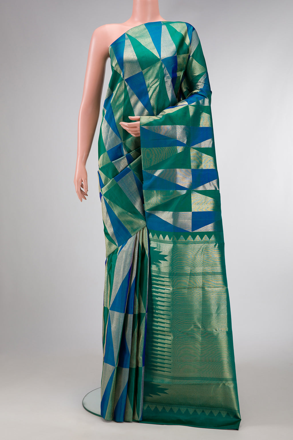 Green and Peacock Blue Color Kanchipuram Silk Saree with Zari Brocade on the body and Without Border.  displayed on a mannequin