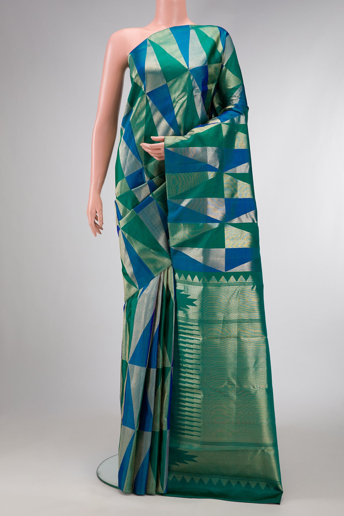 Green and Peacock Blue Color Kanchipuram Silk Saree with Zari Brocade on the body and Without Border.  displayed on a mannequin