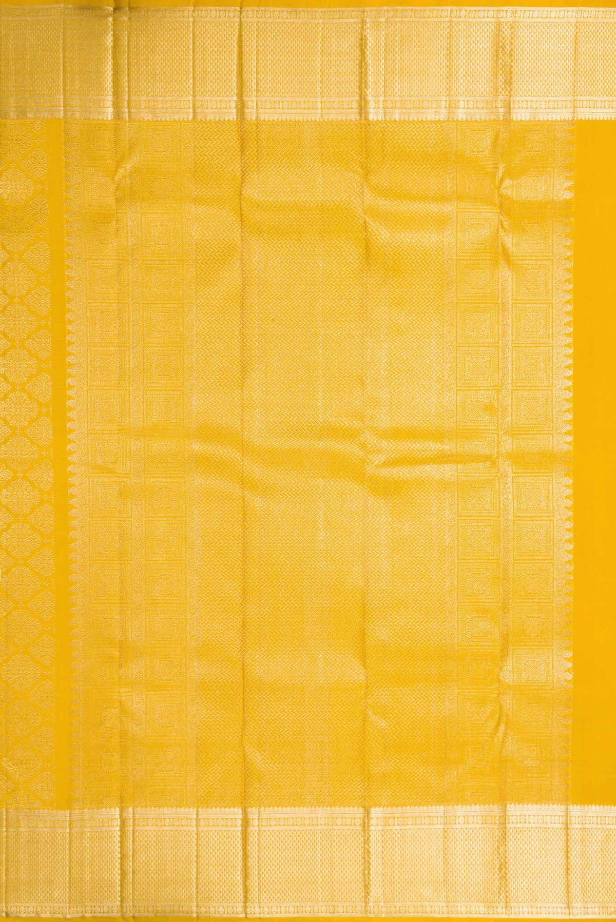 Close up image of the pallu of Mustard Dual Tone Kanchipuram Silk Saree with Zari Brocade on the body and Zari Border