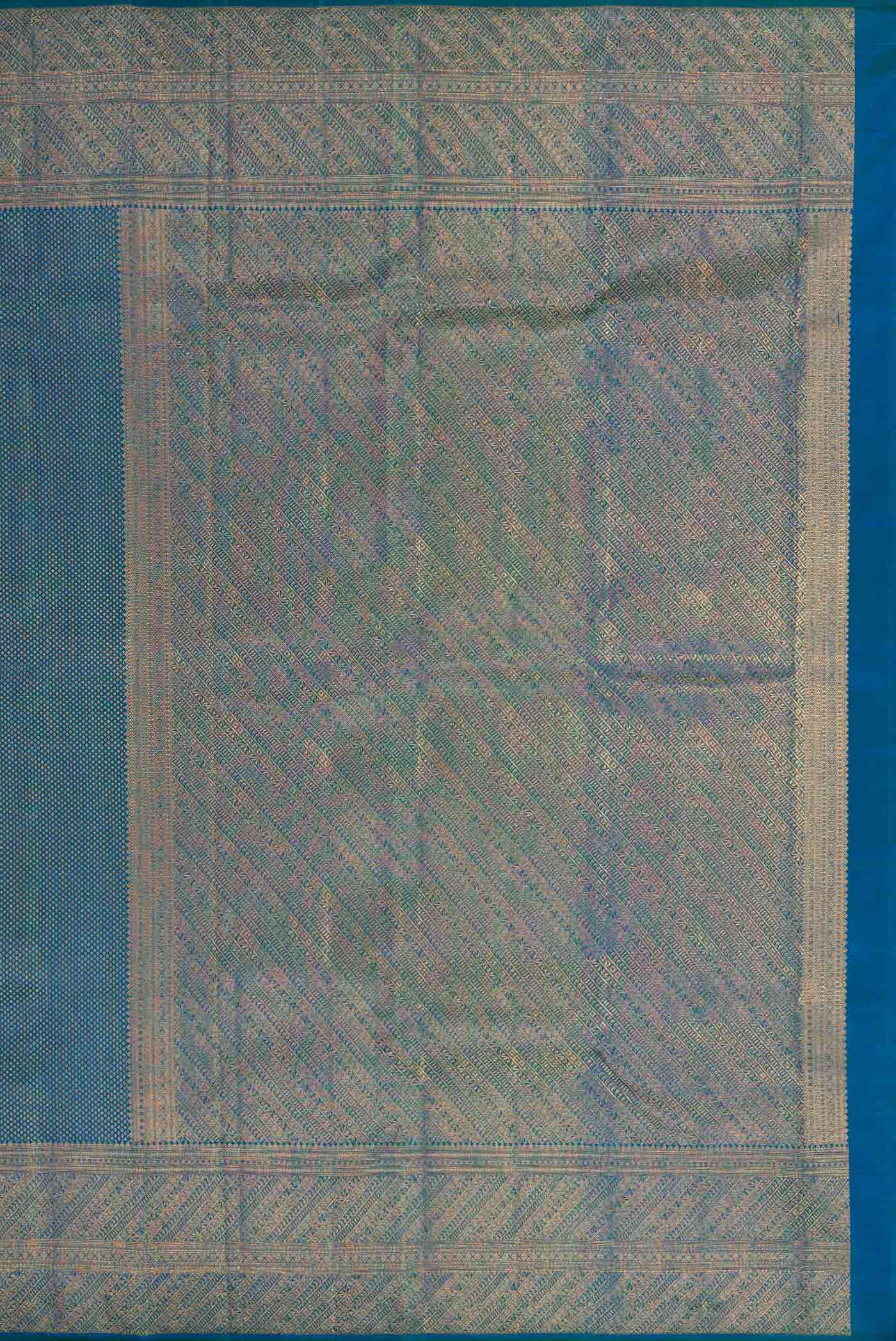 Close up image of the pallu of Peacock Blue Dual Tone Kanchipuram Silk Saree with Zari Brocade on the body and Zari Border. 