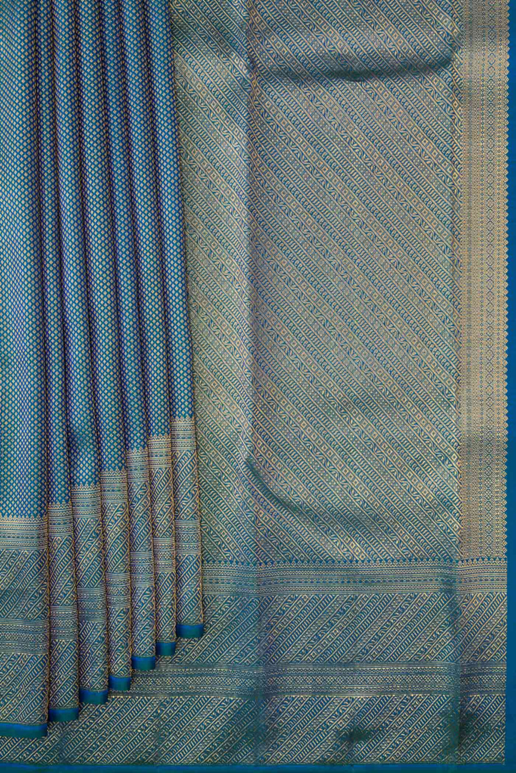 Pleats and pallu of Peacock Blue Dual Tone Kanchipuram Silk Saree with Zari Brocade on the body and Zari Border. 