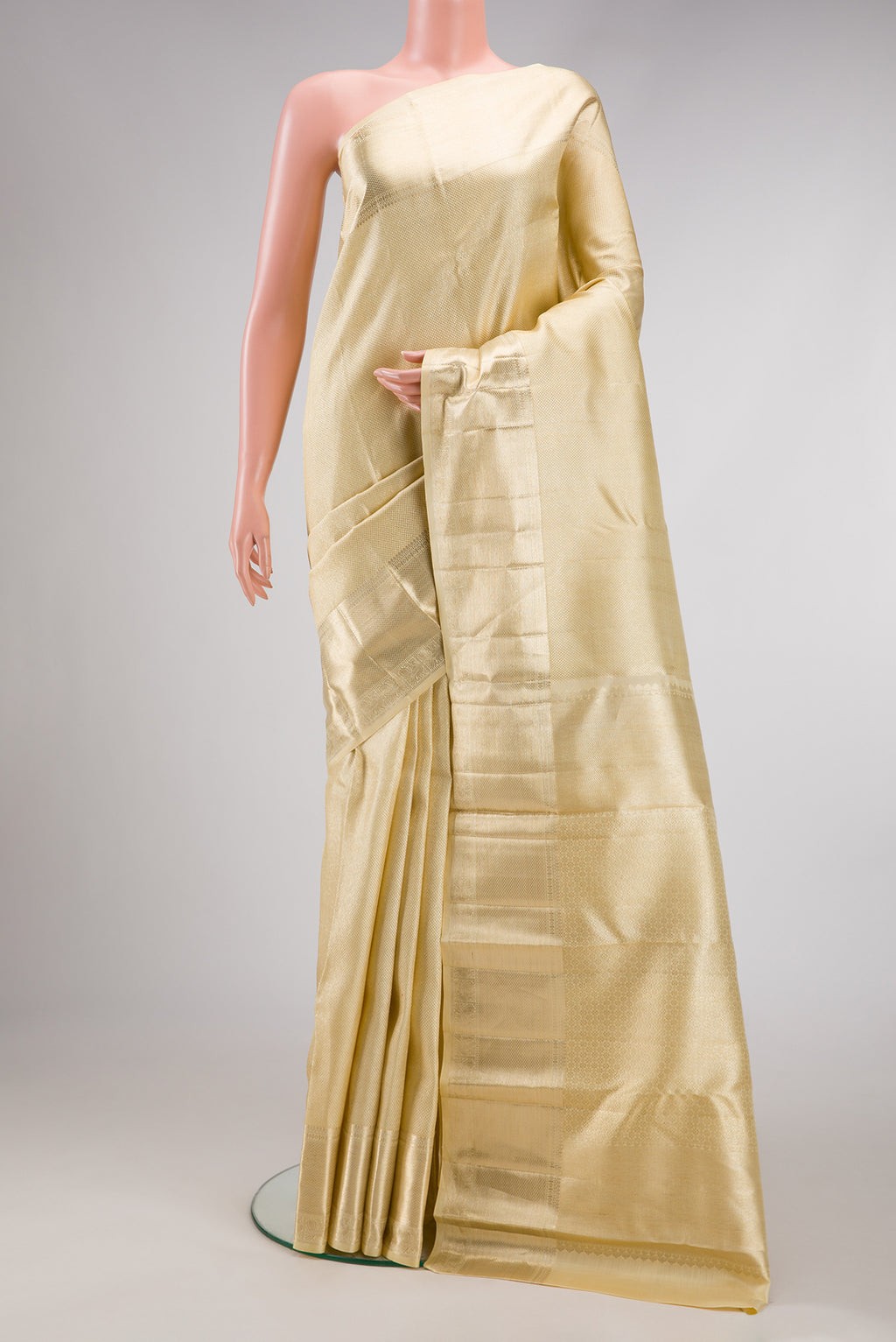 Sandal Dual Tone Kanchipuram Silk Saree with Zari Brocade on the body and Zari Border.  displayed on a mannequin