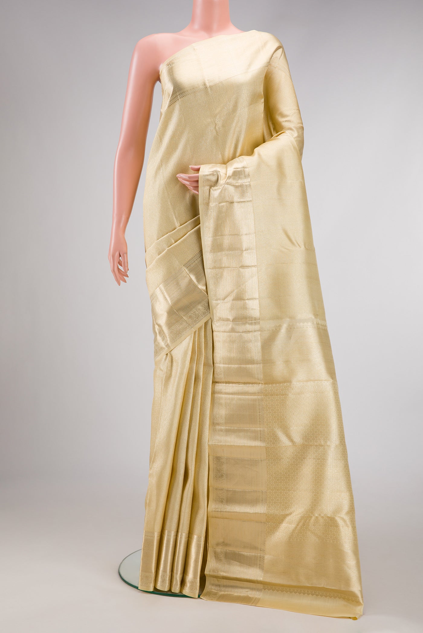 Sandal Dual Tone Kanchipuram Silk Saree with Zari Brocade on the body and Zari Border.  displayed on a mannequin