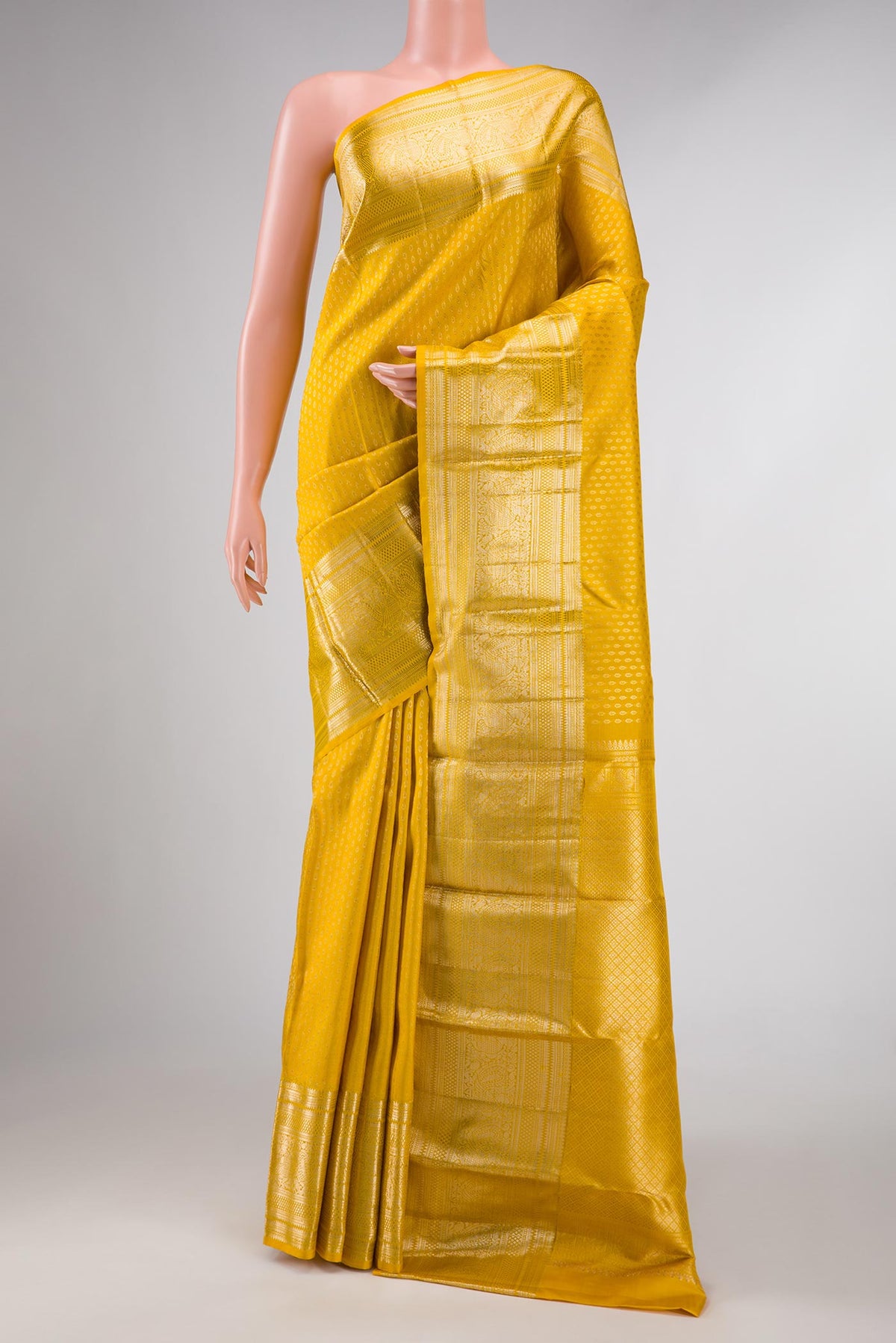 Yellow Dual Tone Kanchipuram Silk Saree with Zari Brocade on the body and Zari Border displayed on a mannequin