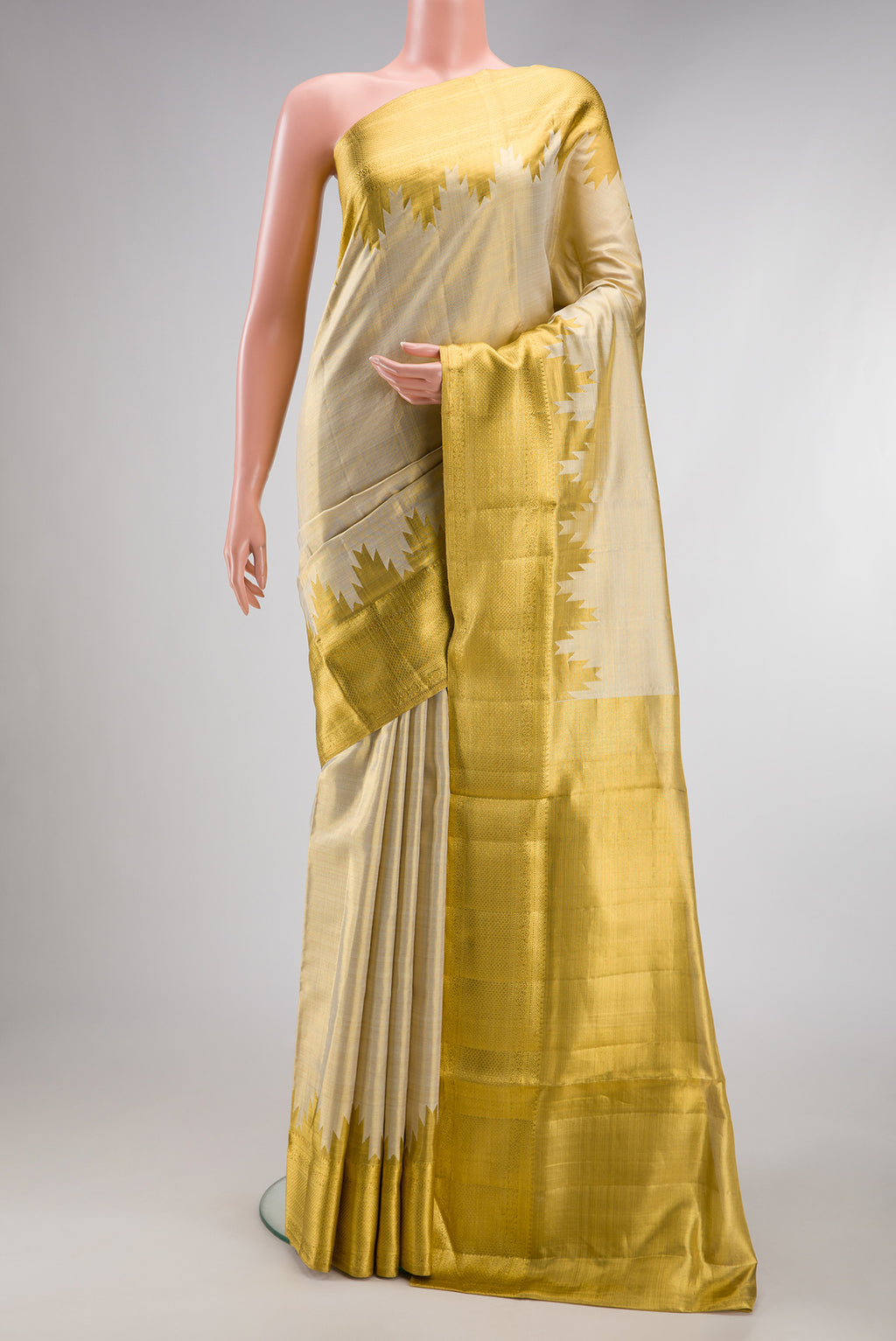 Gold Dual Tone Kanchipuram Tissue Silk Saree with Zari Brocade on the body and Zari Border.  displayed on a mannequin