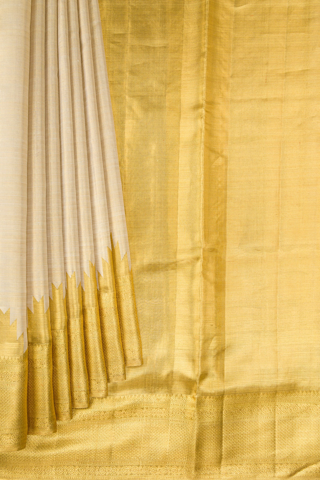 Pleats and pallu of Gold Dual Tone Kanchipuram Tissue Silk Saree with Zari Brocade on the body and Zari Border. 