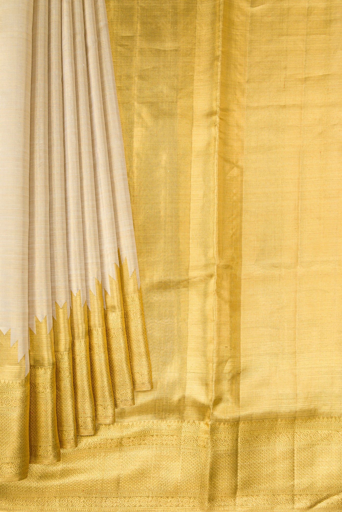 Pleats and pallu of Gold Dual Tone Kanchipuram Tissue Silk Saree with Zari Brocade on the body and Zari Border. 
