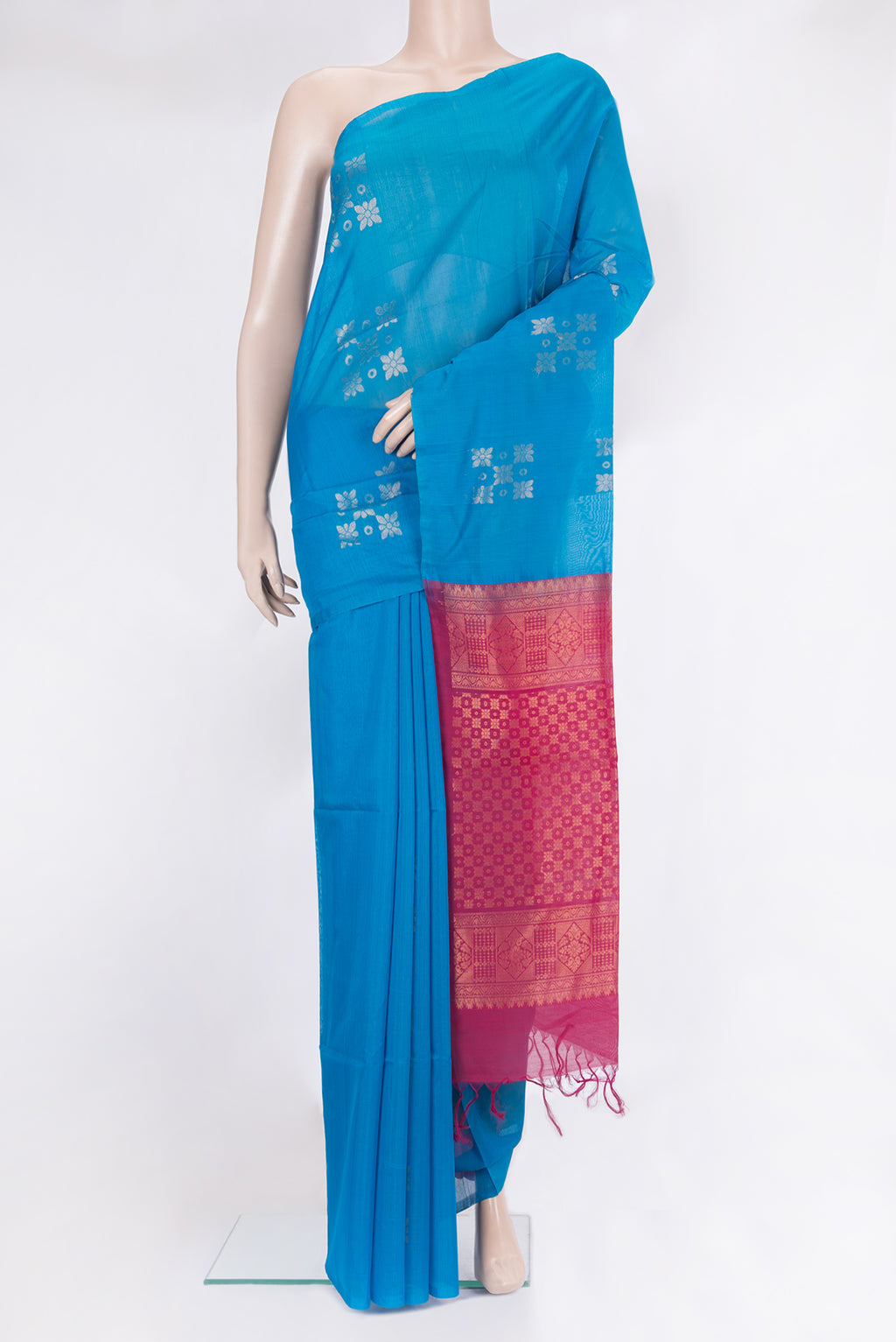 Sky Blue Dual Tone Silk Cotton Saree with Zari Butta on the body and Without Border.  displayed on a mannequin