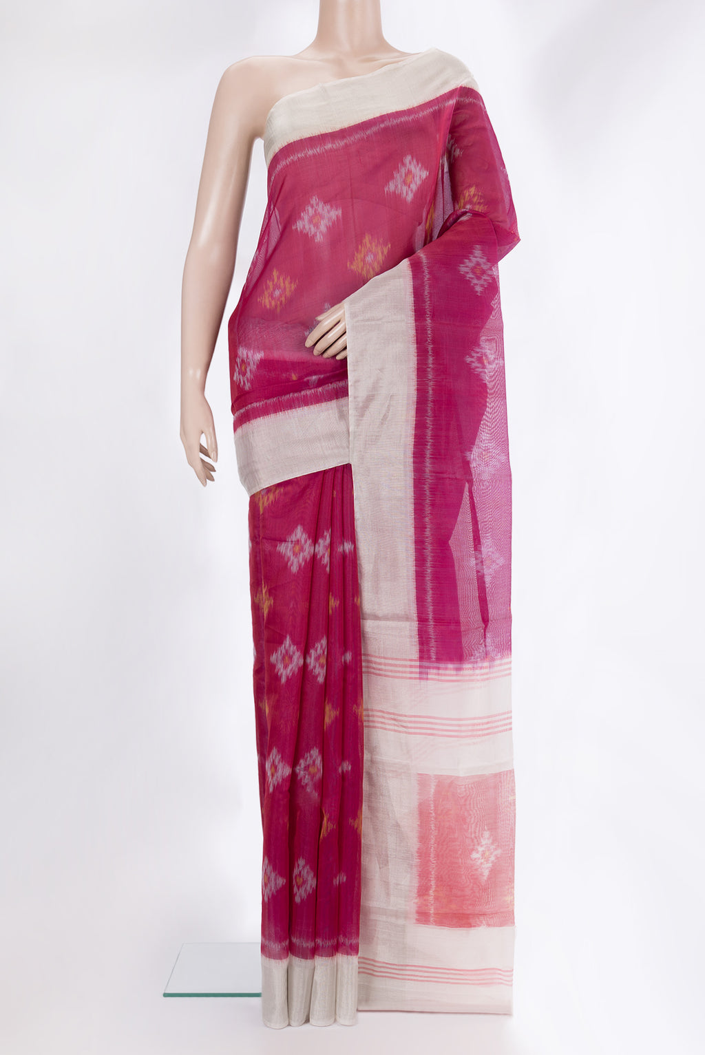 Dark Pink Silk Cotton Saree with Ikat Print on the body and Zari Border.  displayed on a mannequin