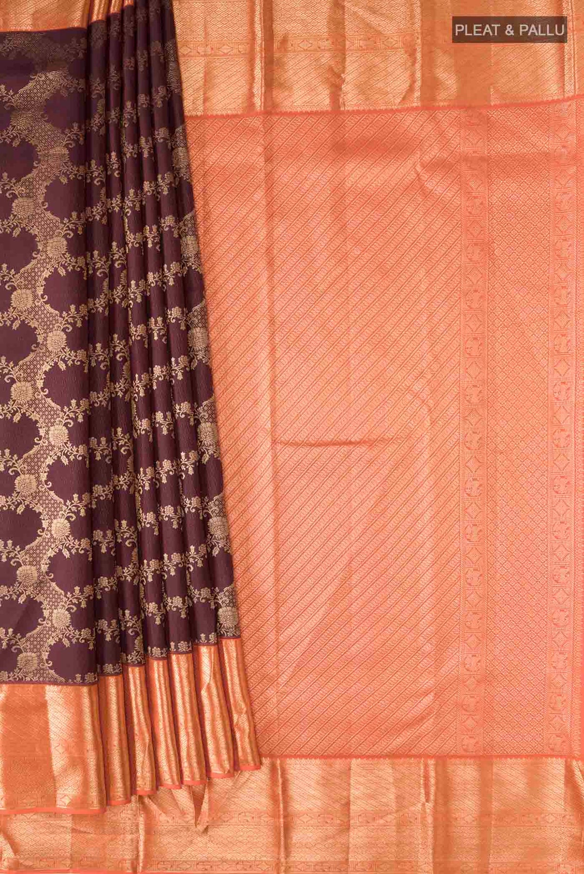 Pleats and pallu of Brown Kanchipuram Silk Saree with Zari Butta on the body and Zari Border