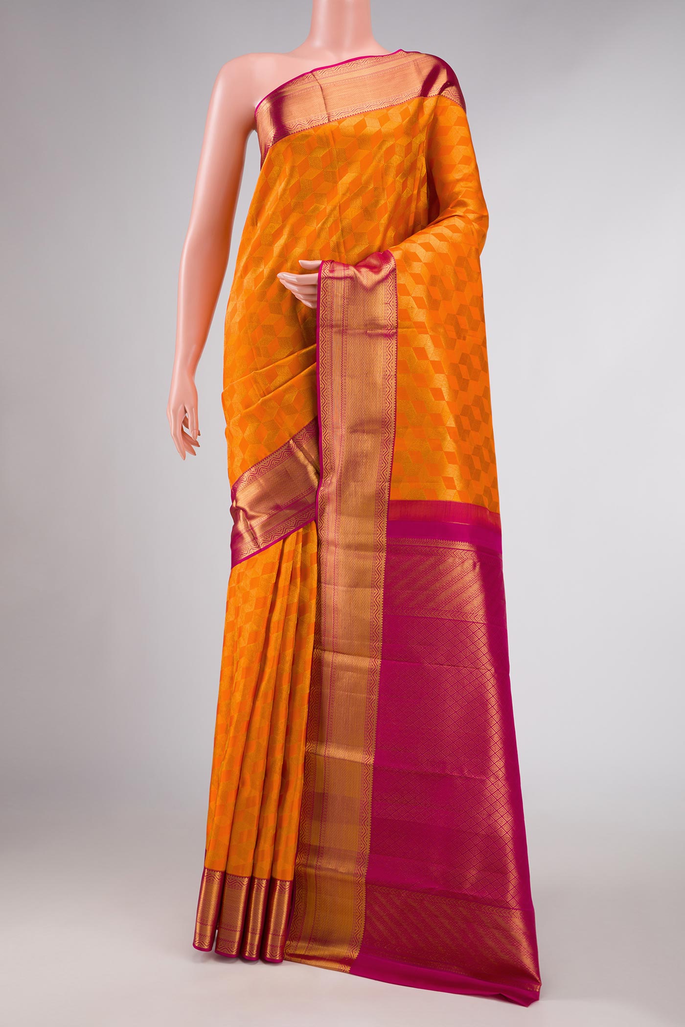 Orange Dual Tone Kanchipuram Silk Saree with Zari Brocade on the body and Zari Border displayed on a mannequin