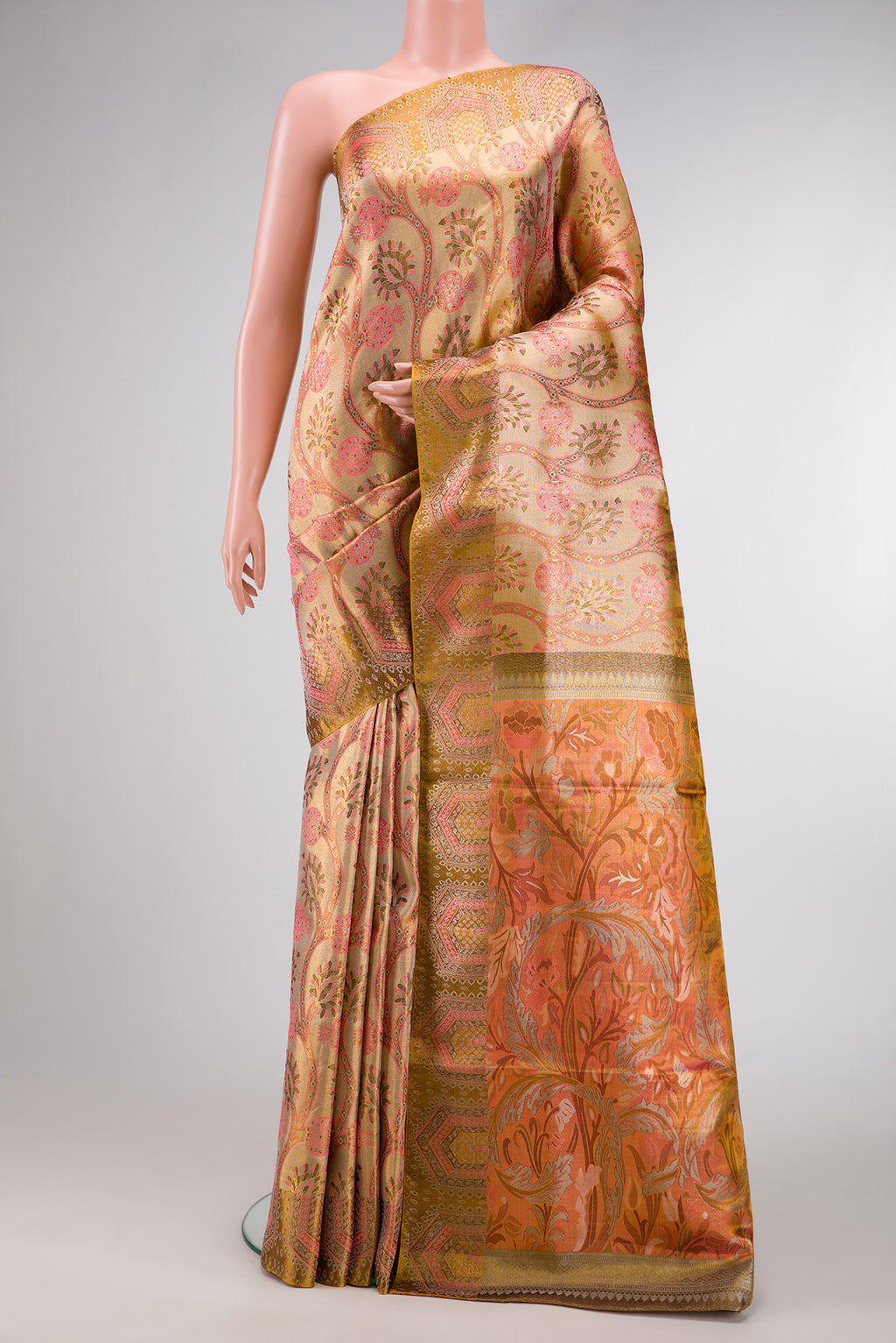 Gold Dual Tone Kanjivaram Tissue Silk Saree with Zari Brocade on the body and Zari Border.  displayed on a mannequin