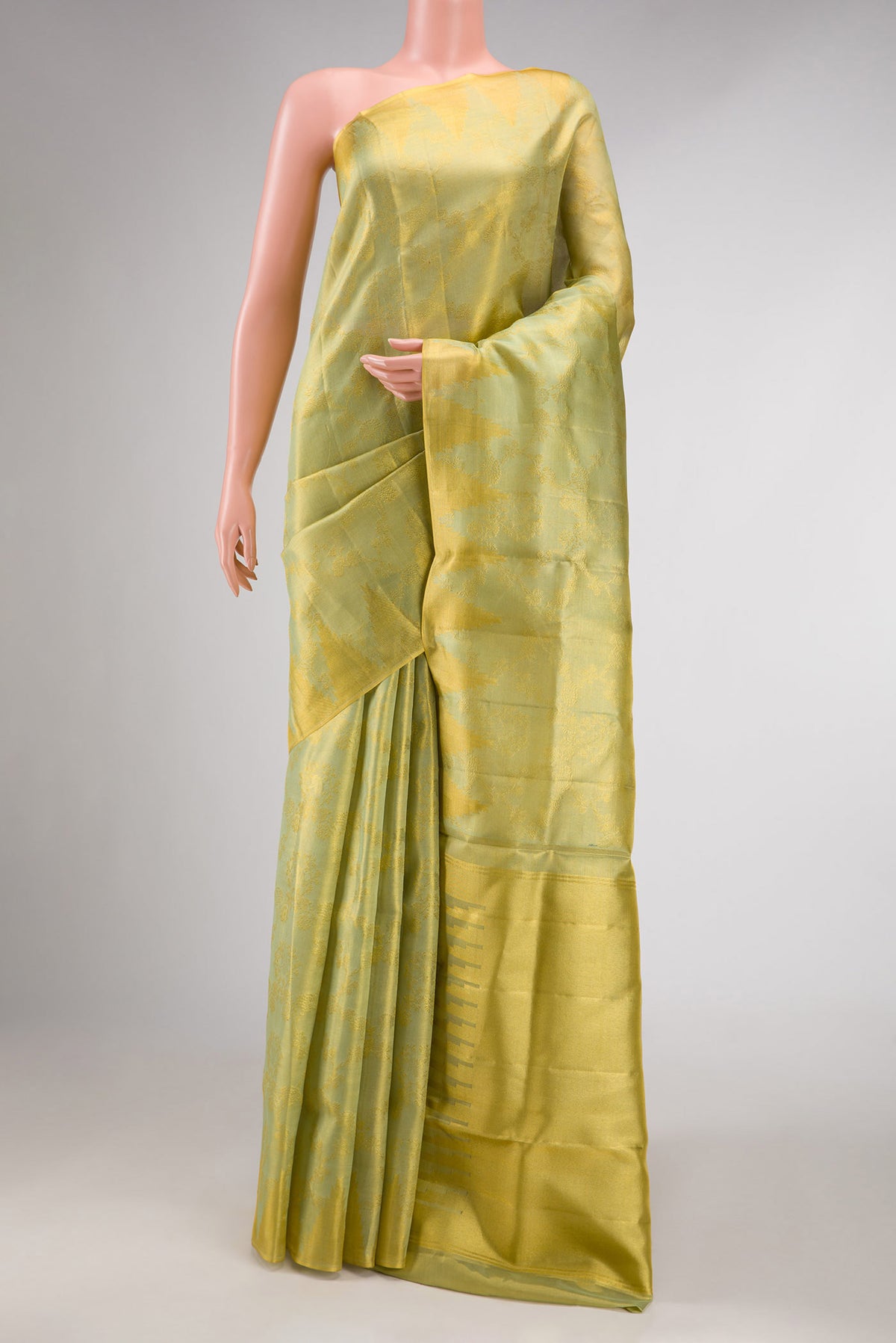 Light Green Dual Tone Kanchipuram Tissue Silk Saree with Zari Brocade on the body and Zari Border displayed on a mannequin