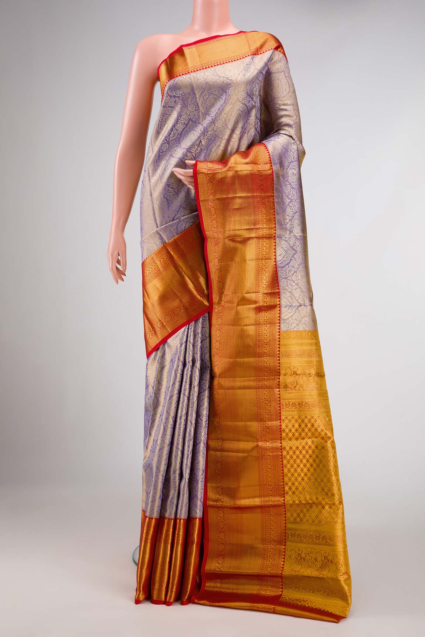 Lavender Dual Tone Kanchipuram Tissue Silk Saree with Zari Brocade on the body and Zari Border.  displayed on a mannequin