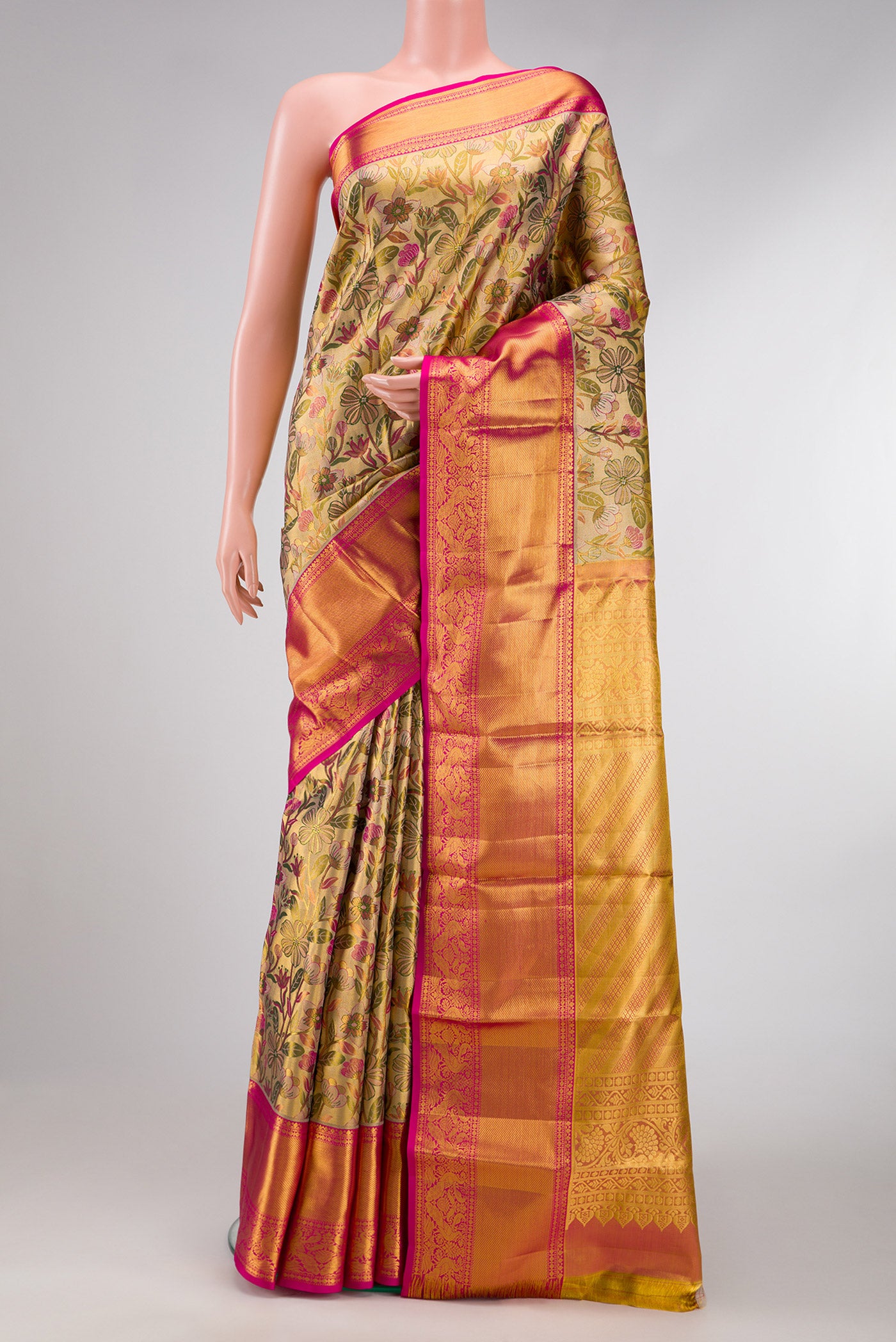 Gold Dual Tone Kanchipuram Tissue Silk Saree with Zari Brocade on the body and Zari Border.  displayed on a mannequin