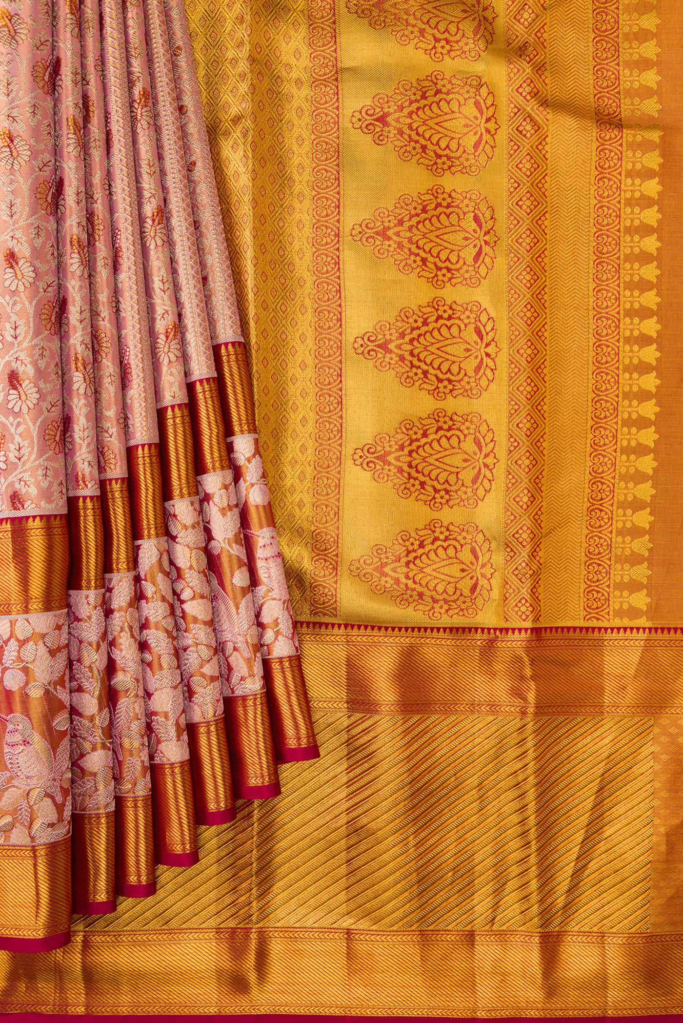 Pleats and pallu of Golden Peach Dual Tone Kanchipuram Tissue Silk Saree with Zari Brocade on the body and Zari Border. 