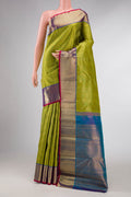 Pure Silk Pure Zari Green Dual Tone Kanchipuram Saree with Zari Brocade on the body and Zari Border displayed on a mannequin