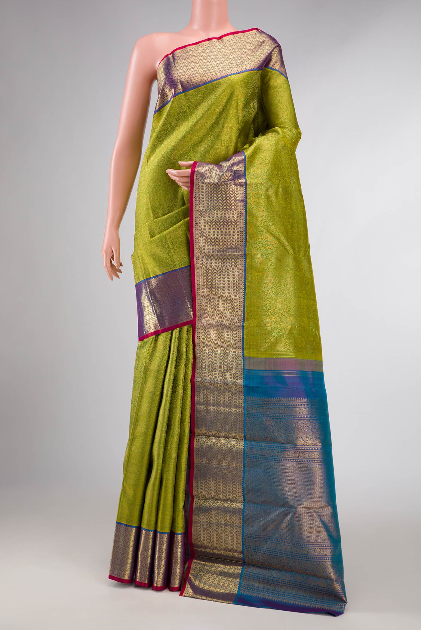 Pure Silk Pure Zari Green Dual Tone Kanchipuram Saree with Zari Brocade on the body and Zari Border displayed on a mannequin