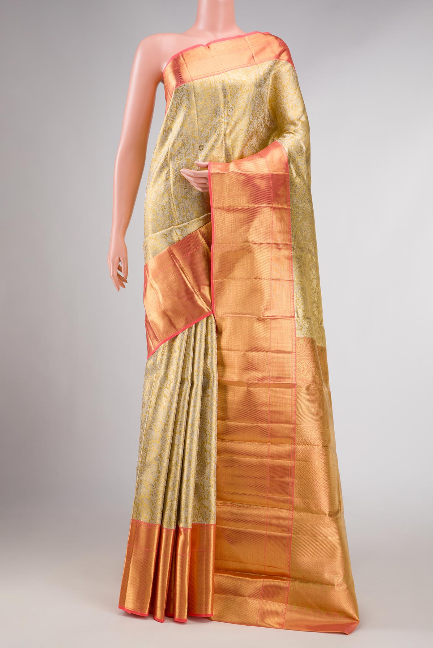 Pure Silk Pure Zari Gold Dual Tone Kanchipuram Tissue Saree with Zari Brocade on the body and Zari Border displayed on a mannequin