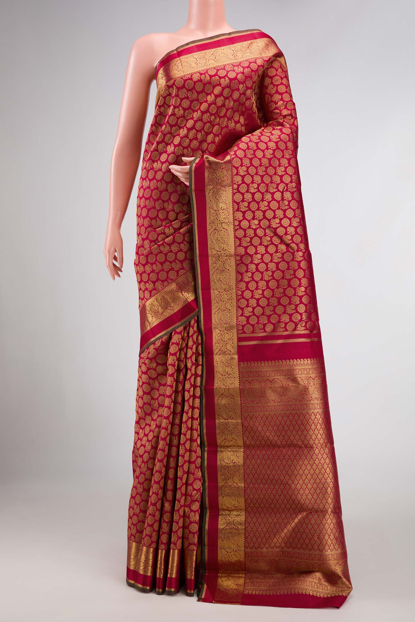 Pure Silk Pure Zari Maroon Dual Tone Kanjivaram Tissue Saree with Zari Brocade on the body and Zari Border.  displayed on a mannequin