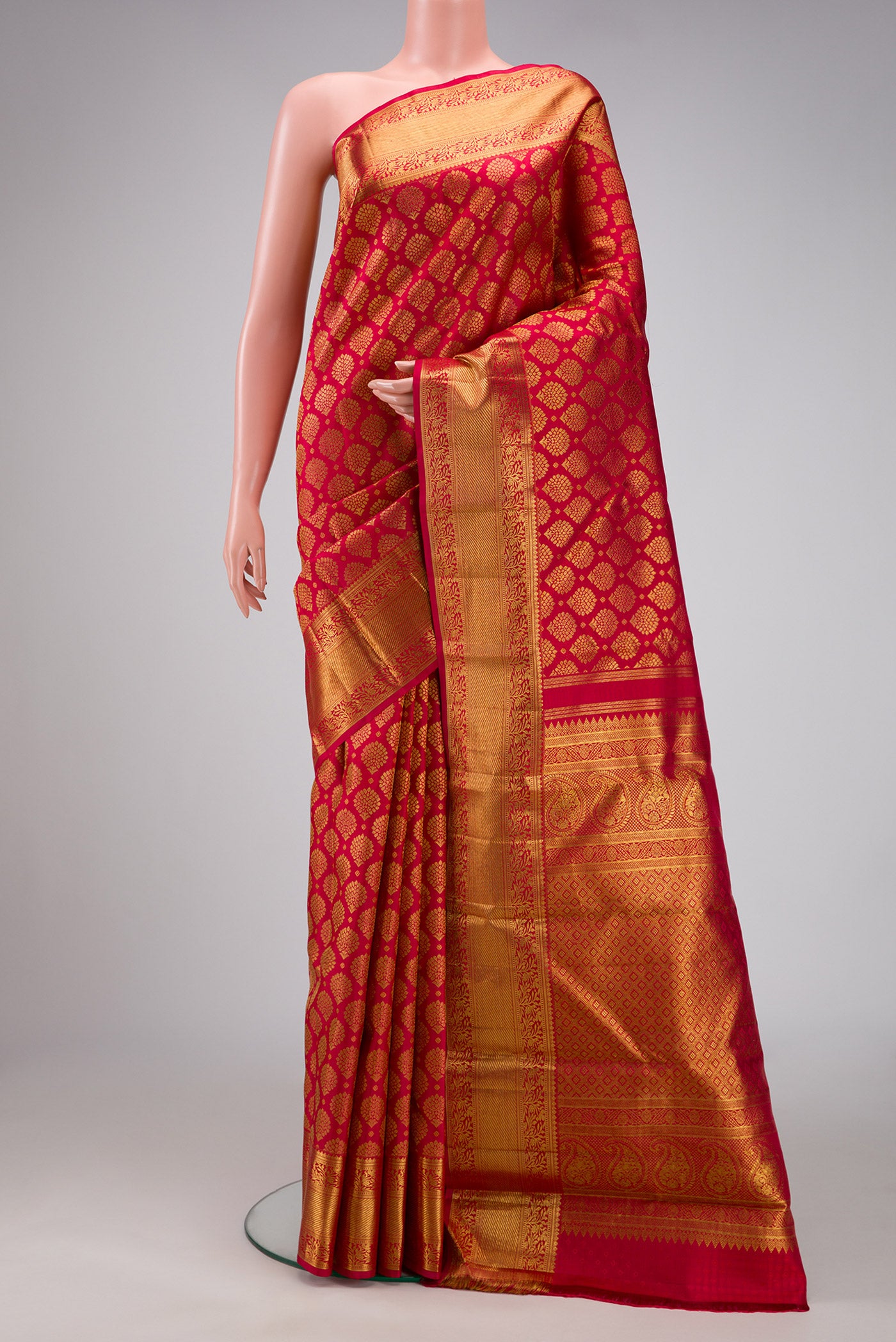 Red Dual Tone Kanchipuram Silk Saree with Zari Brocade on the body and Zari Border.  displayed on a mannequin