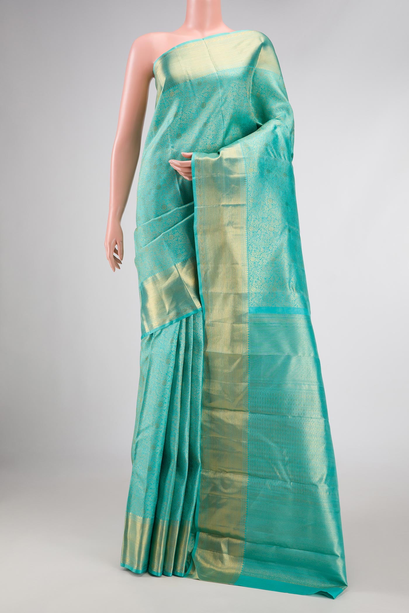 Sky Blue Dual Tone Kanchipuram Silk Saree with Zari Brocade on the body and Zari Border displayed on a mannequin