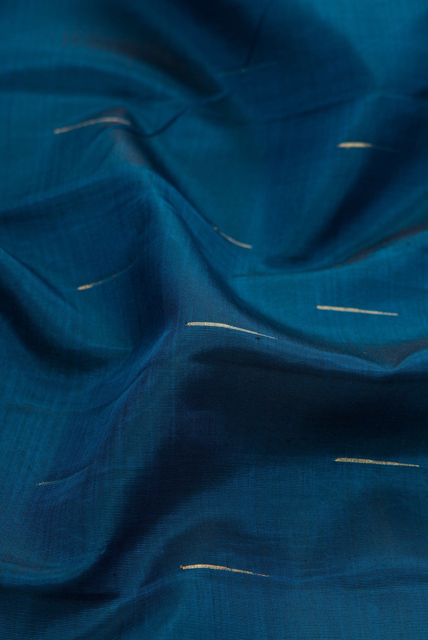 Close up of Pure Silk Pure Zari Maya Blue Dual Tone Kanchipuram Saree with Zari Brocade on the body and Zari Border.  displaying folds