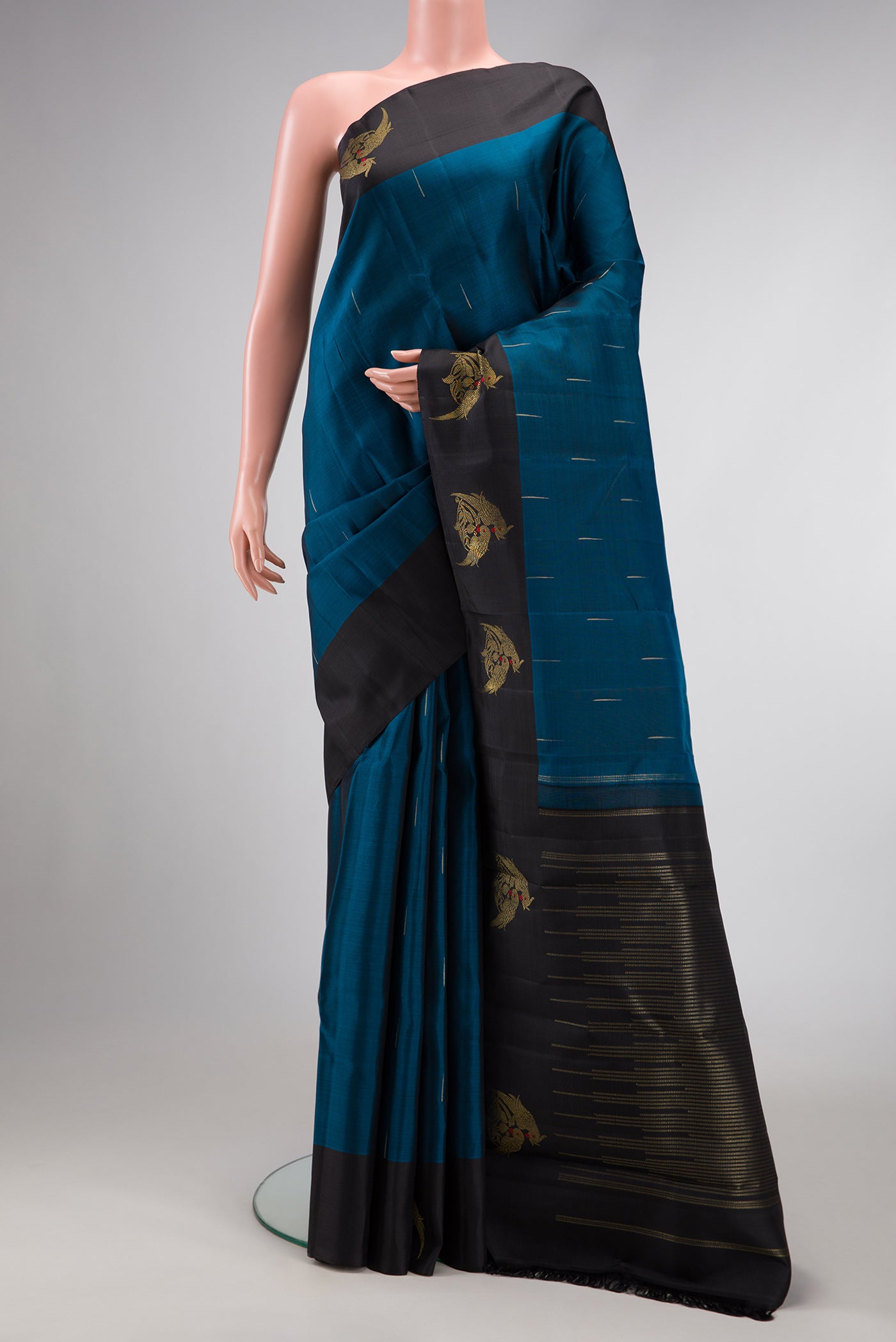 Pure Silk Pure Zari Maya Blue Dual Tone Kanchipuram Saree with Zari Brocade on the body and Zari Border.  displayed on a mannequin