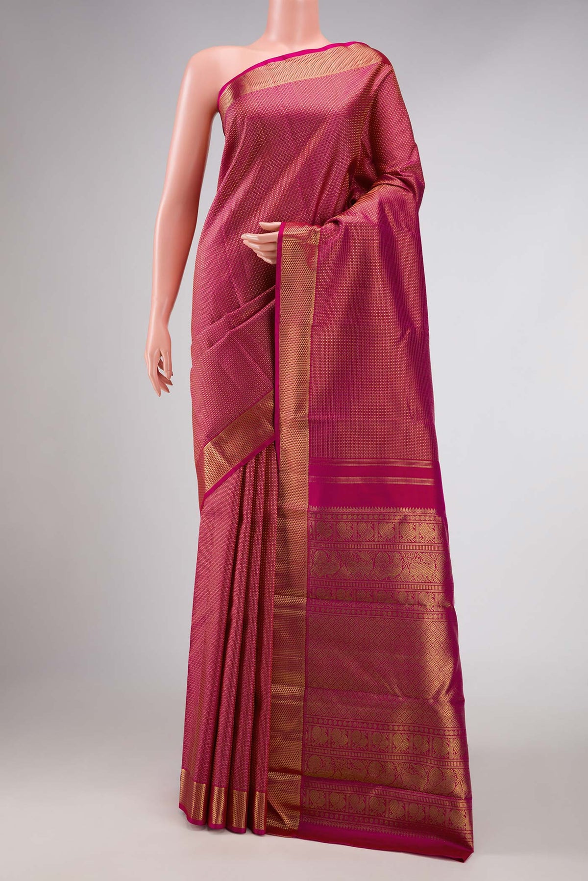 Pure Silk Pure Zari Magenta Dual Tone Kanchipuram Saree with Zari Brocade on the body and Zari Border displayed on a mannequin