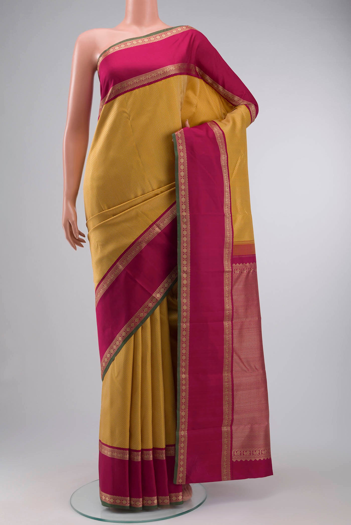 Yellow Kanchipuram Silk Saree with Jacquard design on the body and Thread Border displayed on a mannequin